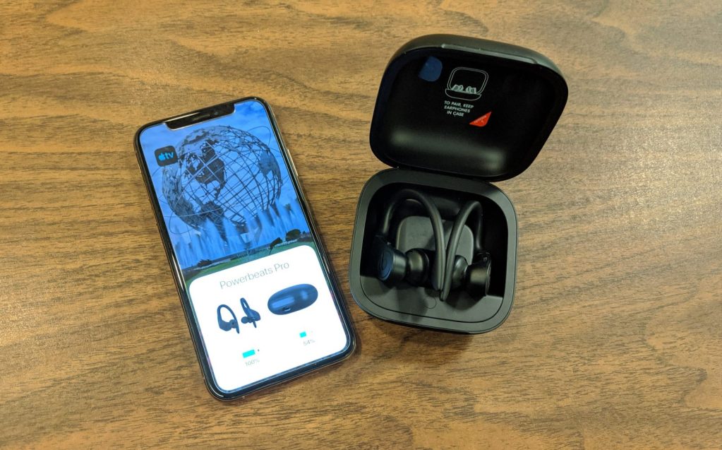 phone on the left. black fold Powerbeats Pro case (right)