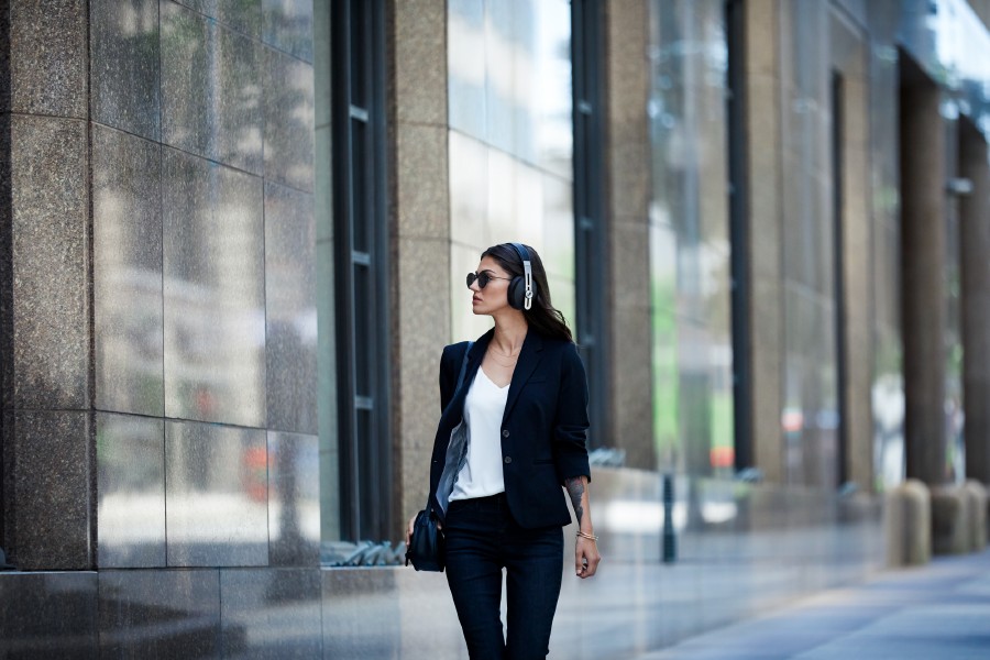 woman walking wearing headphones