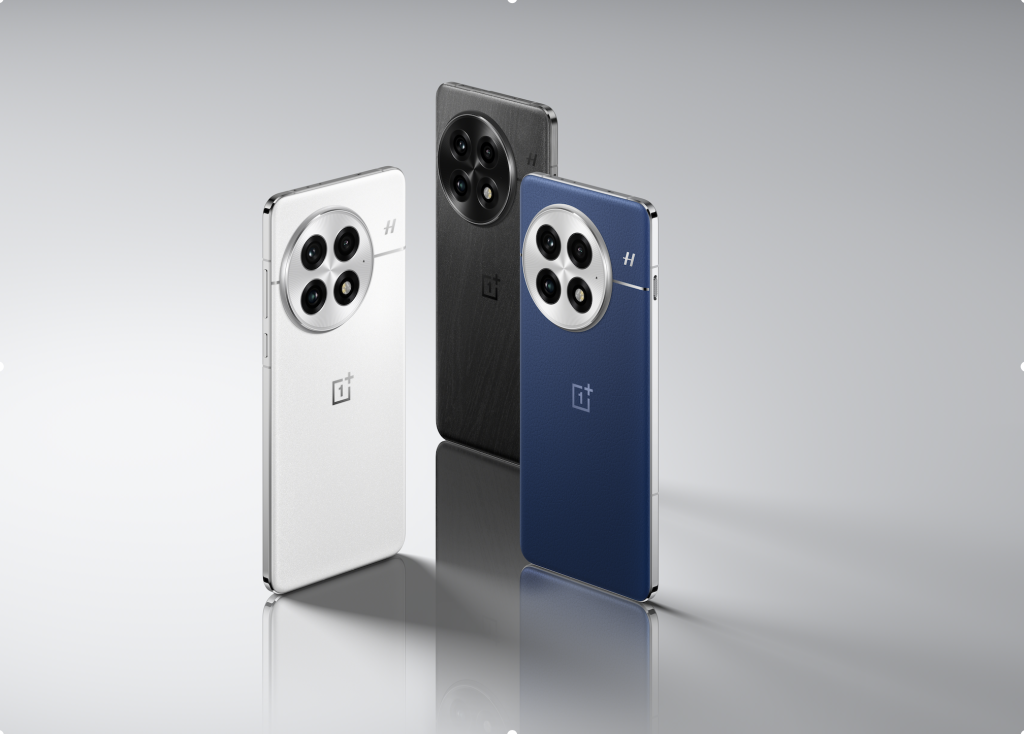 three phones standing next to each other 